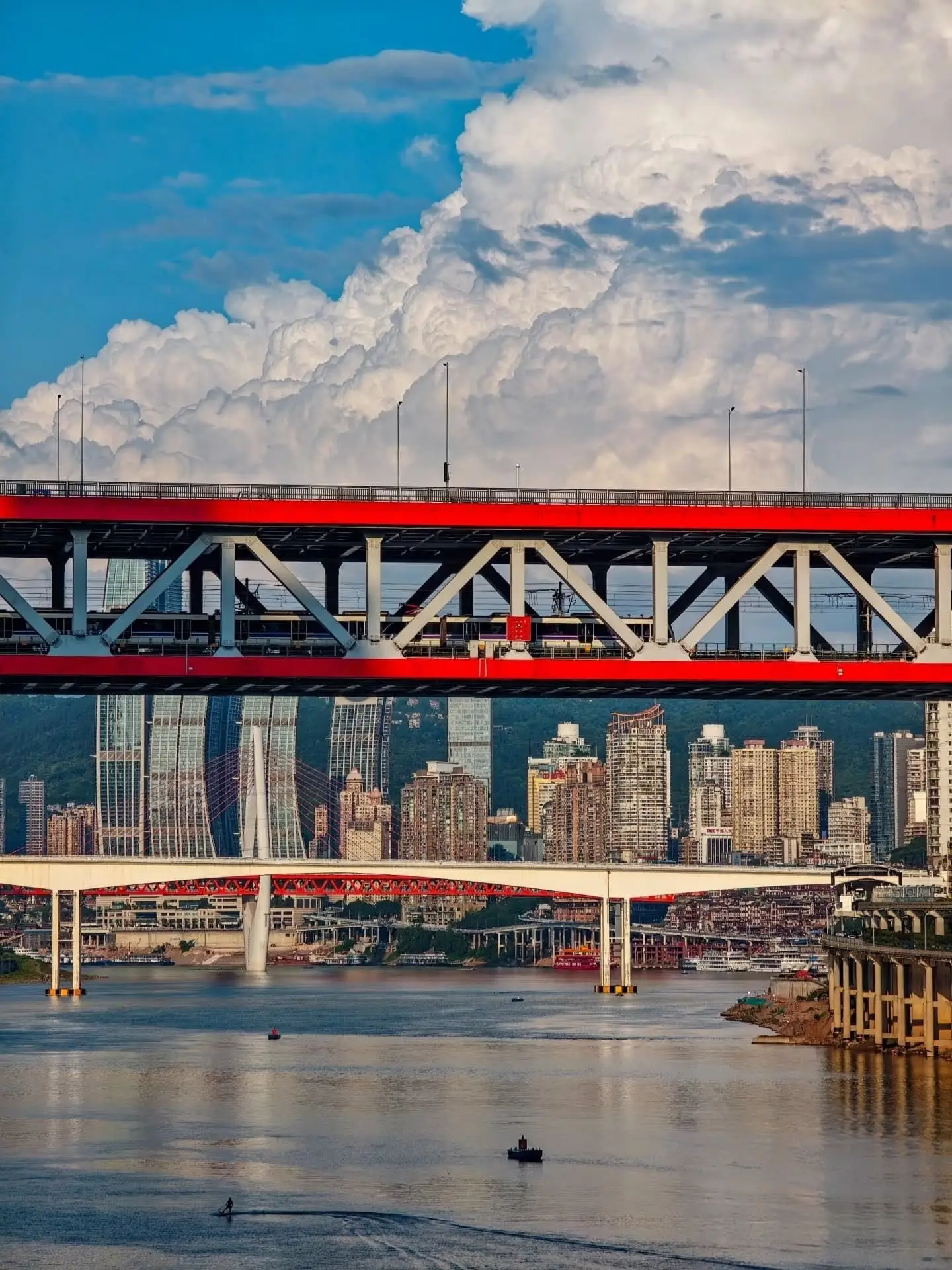 Bright summer sunshine reflecting off the rivers in Chongqing, providing the best weather for clear and dramatic city views.